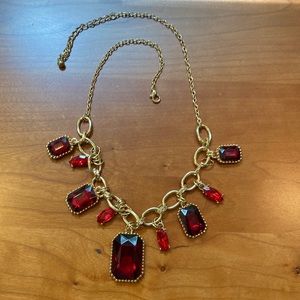 Red and gold tone necklace